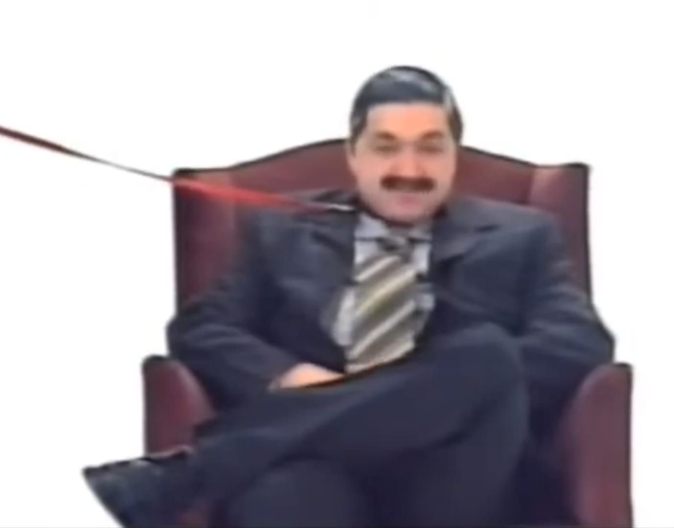 Nelson Taffarel en un sketch de televisión, sentado en un sillón